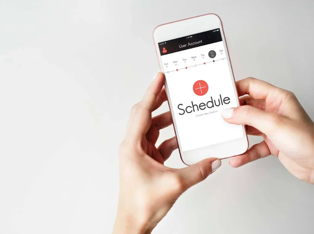 Person scheduling a home cleaning appointment on a calendar