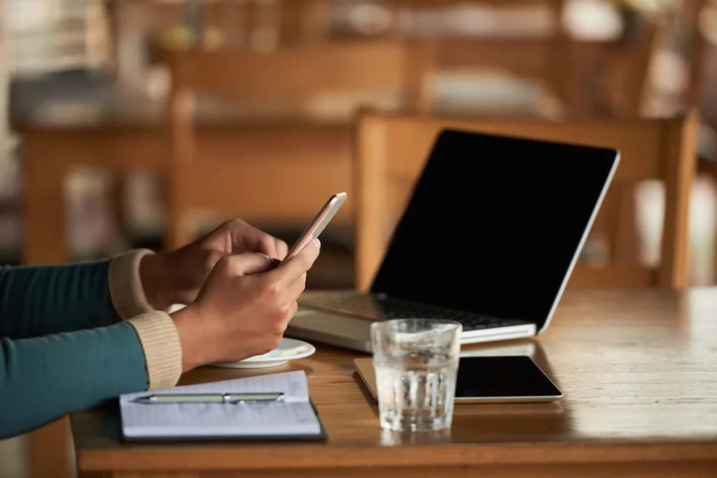 Person using a laptop to request a cleaning service quote online