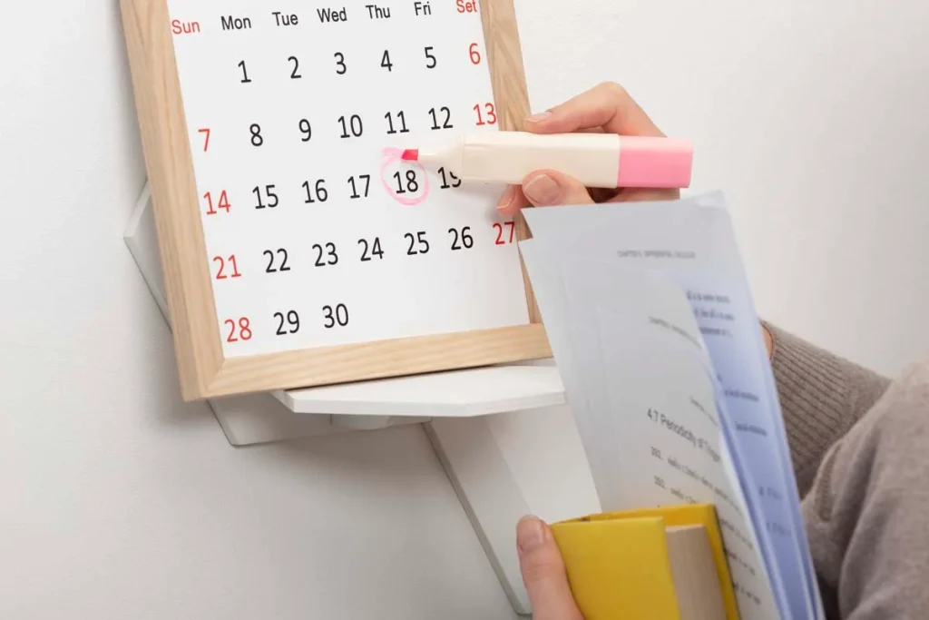 Selecting a date on a calendar to schedule a house cleaning appointment